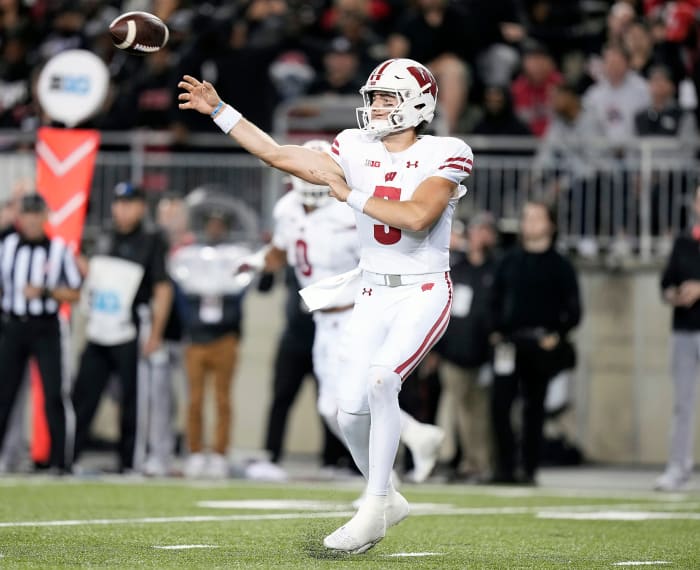 Wisconsin quarterback Graham Mertz throwing the football against Ohio State.